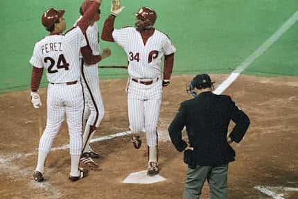 FILE - Philadelphia Phillies Gary Matthews (34) is congratulated at home plate by teammate...