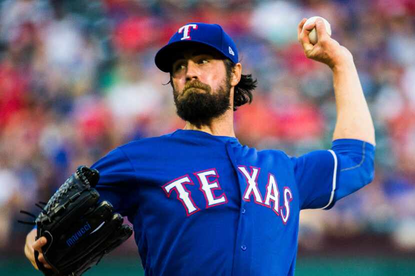 Texas Rangers starting pitcher Cole Hamels (35) pitches during the first inning of an MLB...