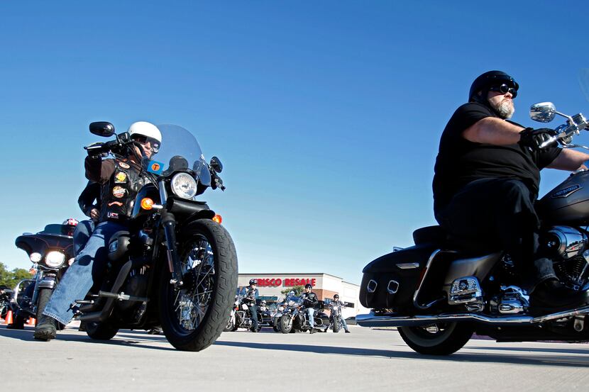 Bikers make their way out of the Frisco Resale parking lot at the Riding 4 Meals Motorcycle...
