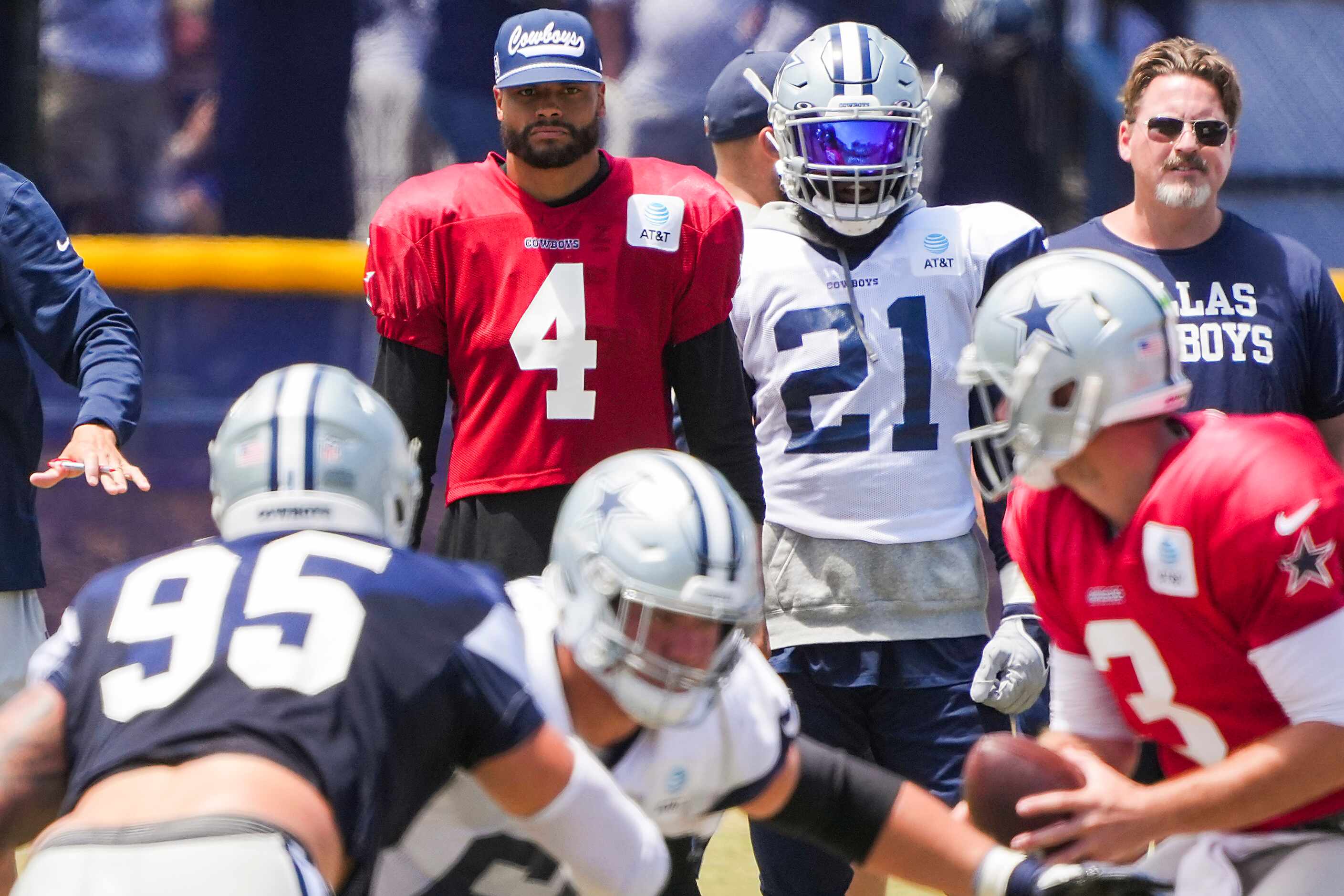 Dallas Cowboys quarterback Dak Prescott (4) and running back Ezekiel Elliott (21) watch...