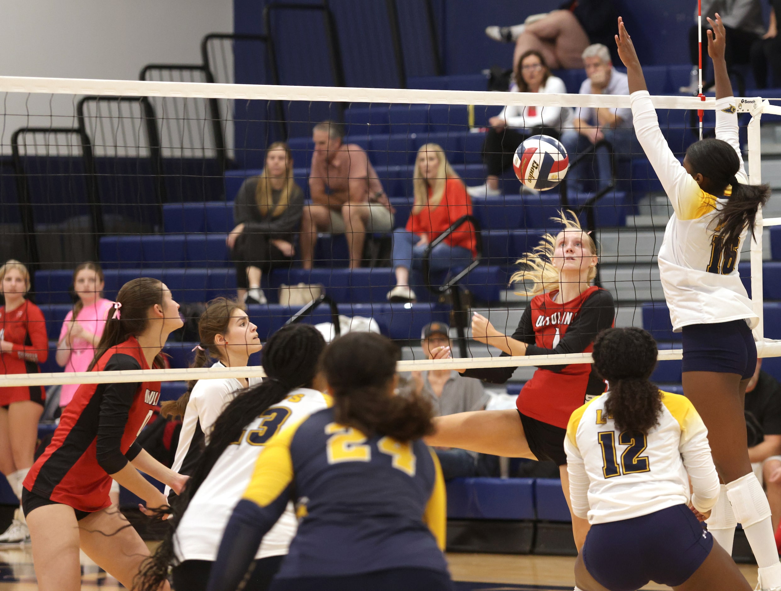 Ursuline player #1 Emma Sorensen tries to stop Prestonwood player #16 Taylor Clarke's return...