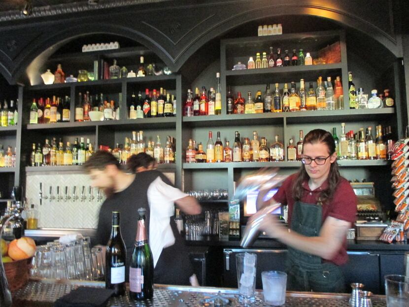 Bartenders mix creative, fun cocktails at Sundry and Vice, an apothecary-speakeasy mash-up. 