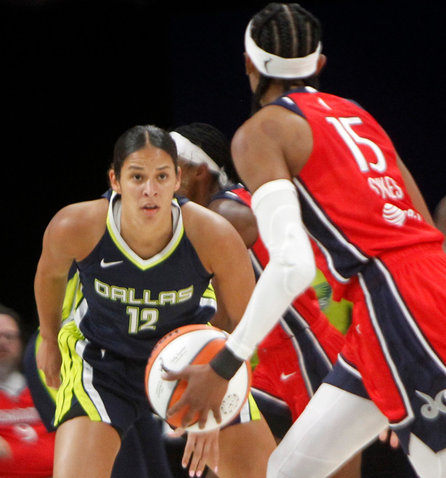 Dallas Wings guard Veronica Burton (12) focuses defensively on Washington Mystics guard...