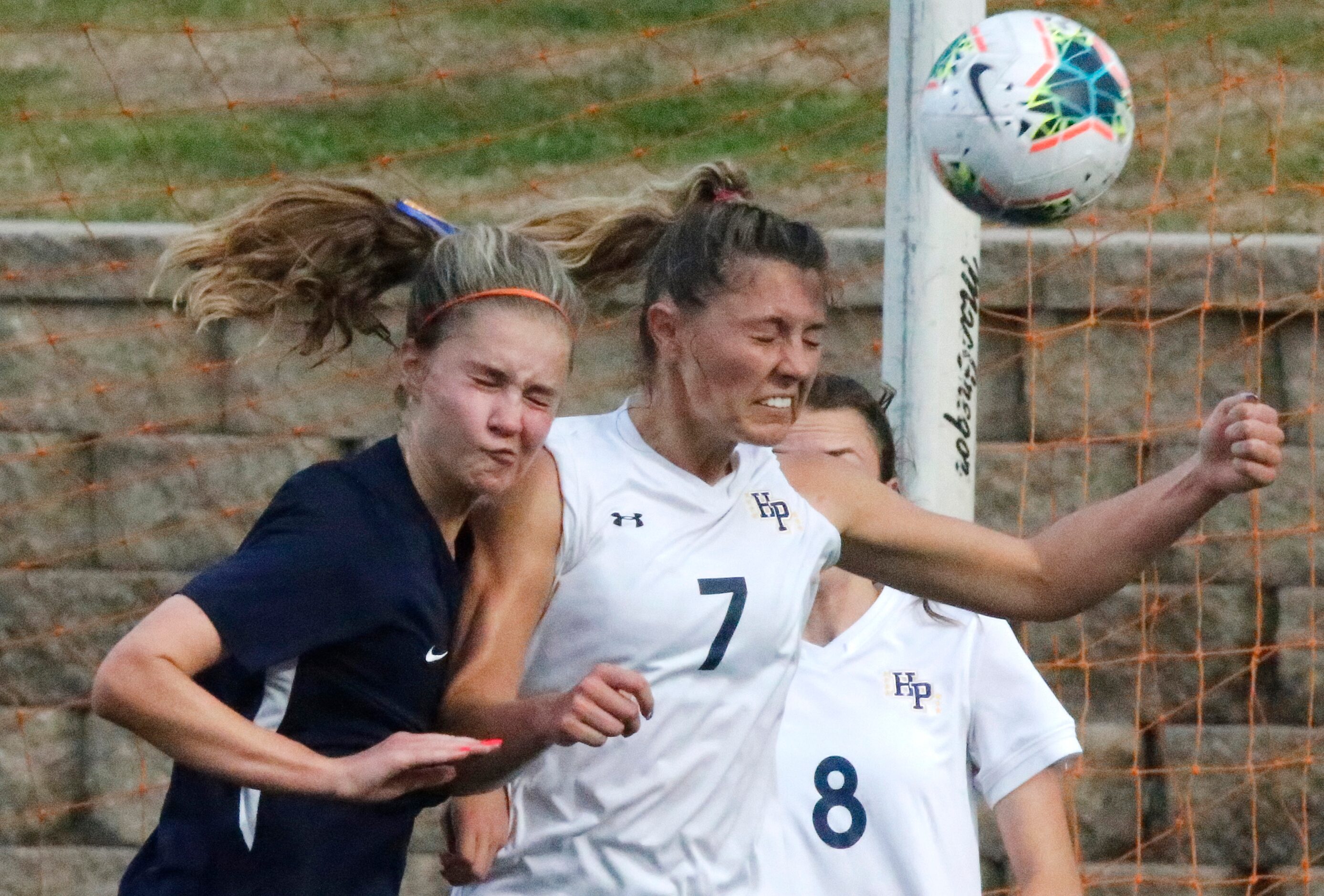 Wakeland midfielder Bella James (3) goes up for a header with Highland Park midfielder EmJ...