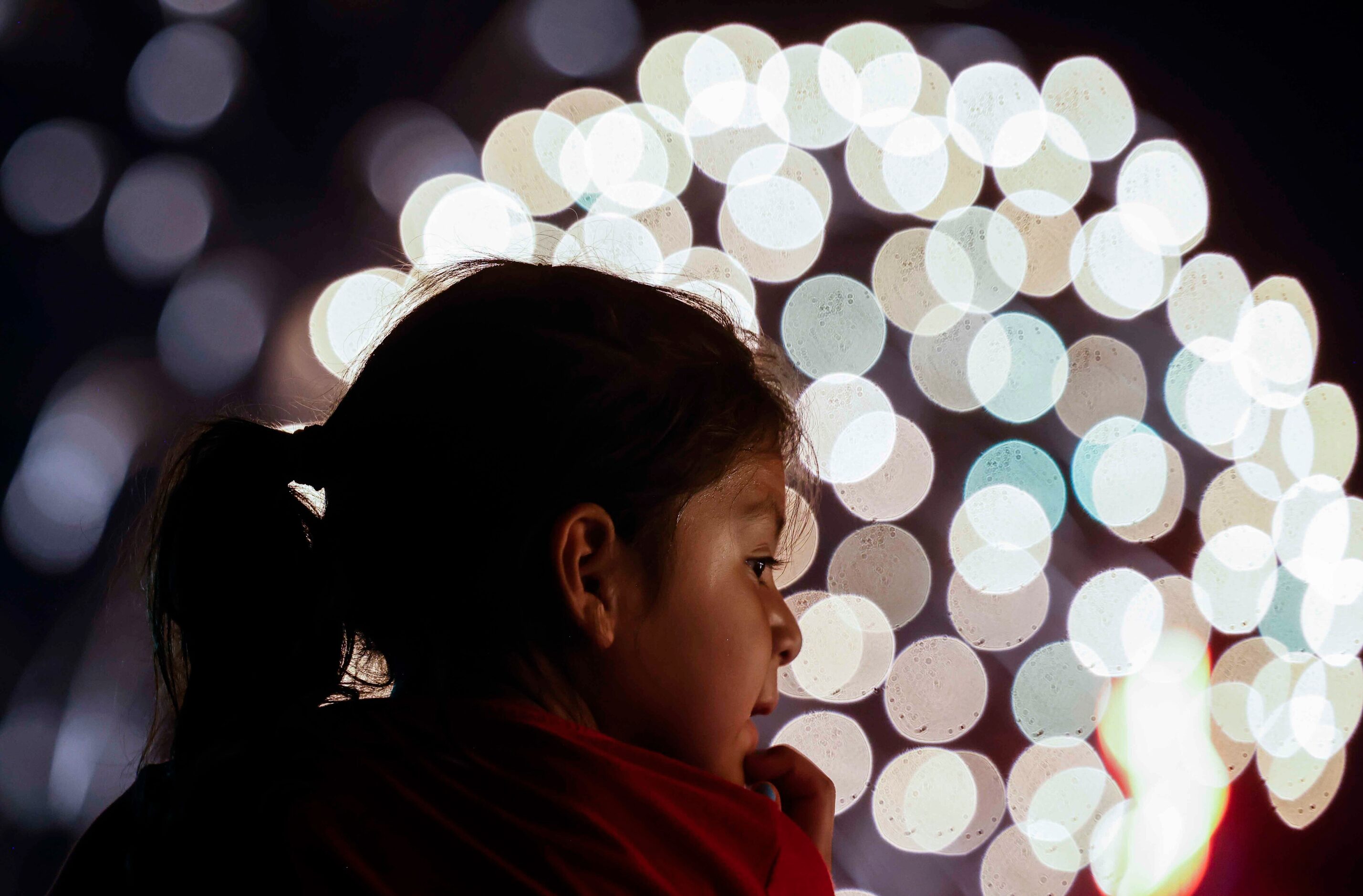 Adelayda Countino, 5, looks as the fireworks explode during an Independence Day celebration...