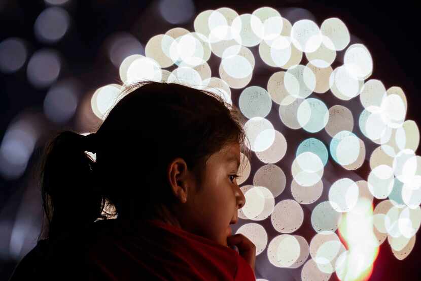Adelayda Countino, 5, looks as the fireworks explode during an Independence Day celebration...