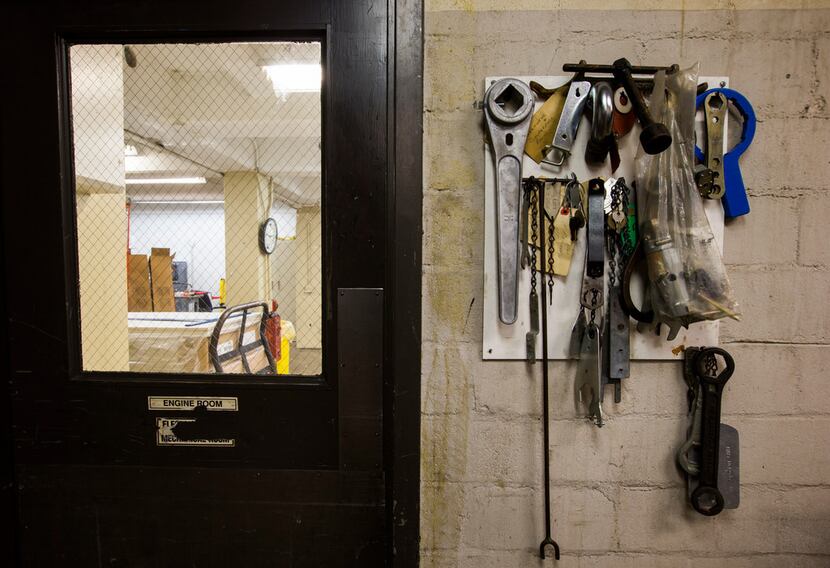 Tools and keys hang on the wall outside the maintenance break room in the basement of the...
