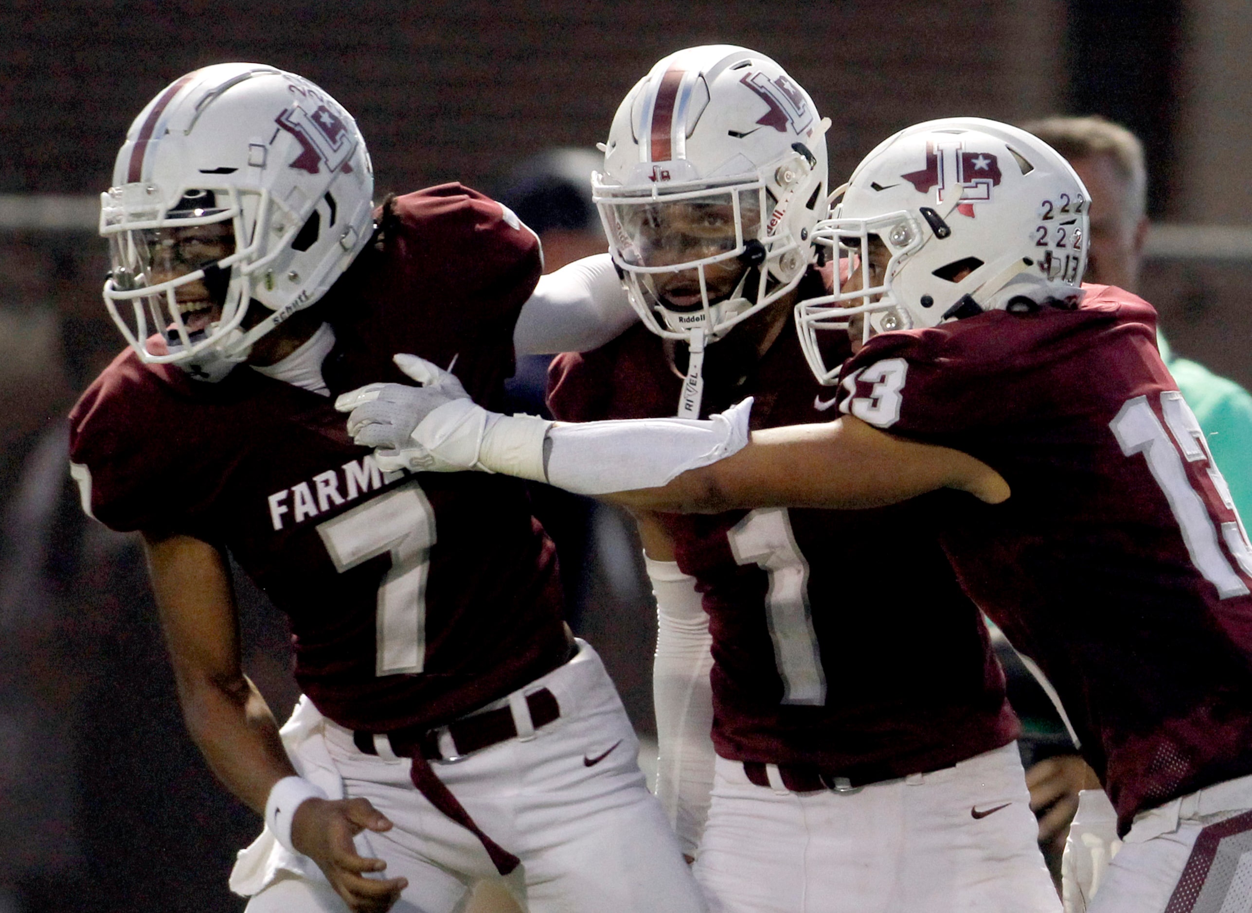 Lewisville quarterback Ethan Terrell (7), left, receiver Jayden Hardy (1), center, and...