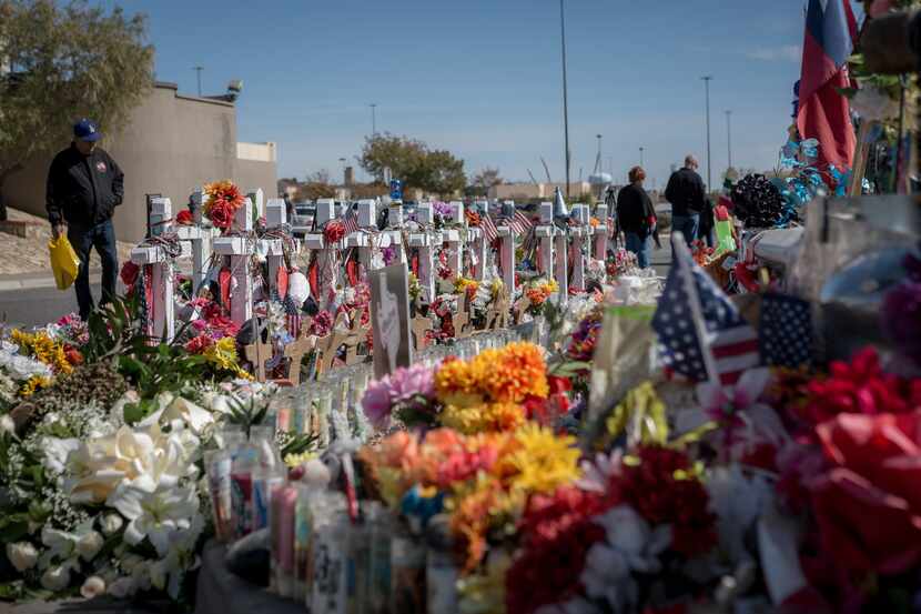 Friends and families of the victims of the August 3 massacre in El Paso visit the site of...