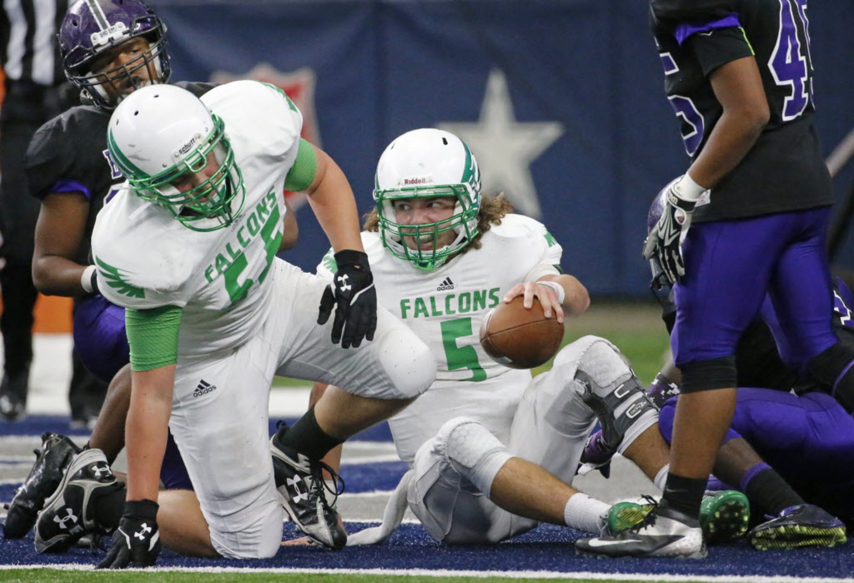 Lake Dallas quarterback Dagan Haehn (5) is all smiles after scoring a second-quarter...