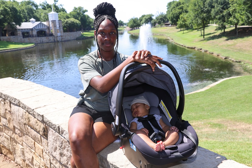 Yashica Halton poses for a photo with her three-month-old daughter Sima, on Wednesday, July...