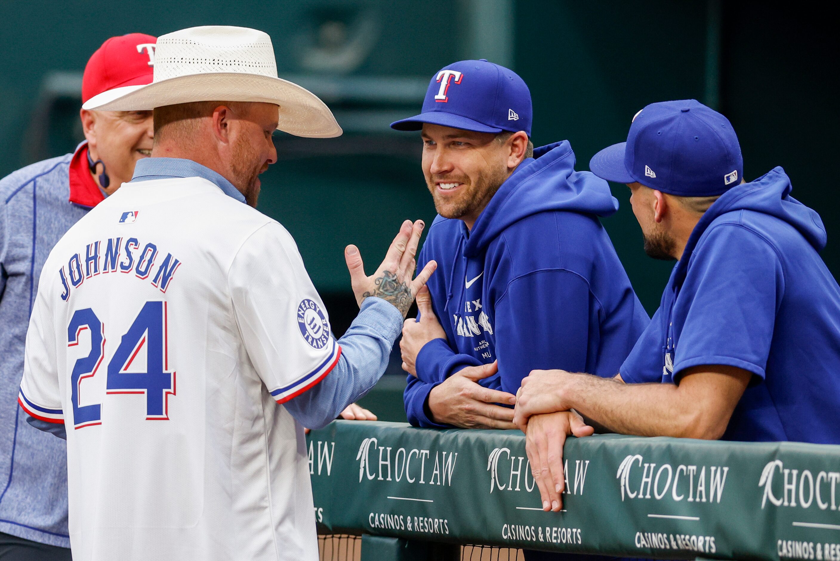 Country music singer Cody Johnson talks with Texas Rangers pitchers Jacob deGrom and Nathan...