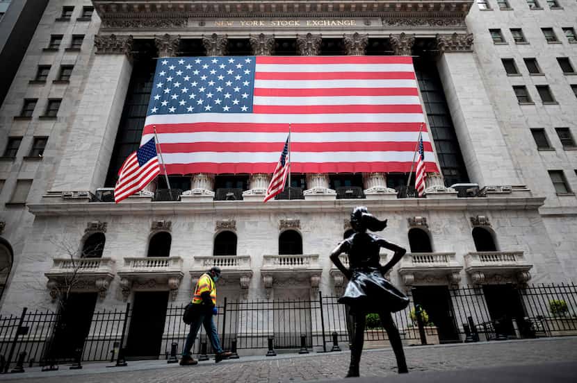 The fearless girl statue and the New York Stock Exchange are pictured on April 20 at Wall...