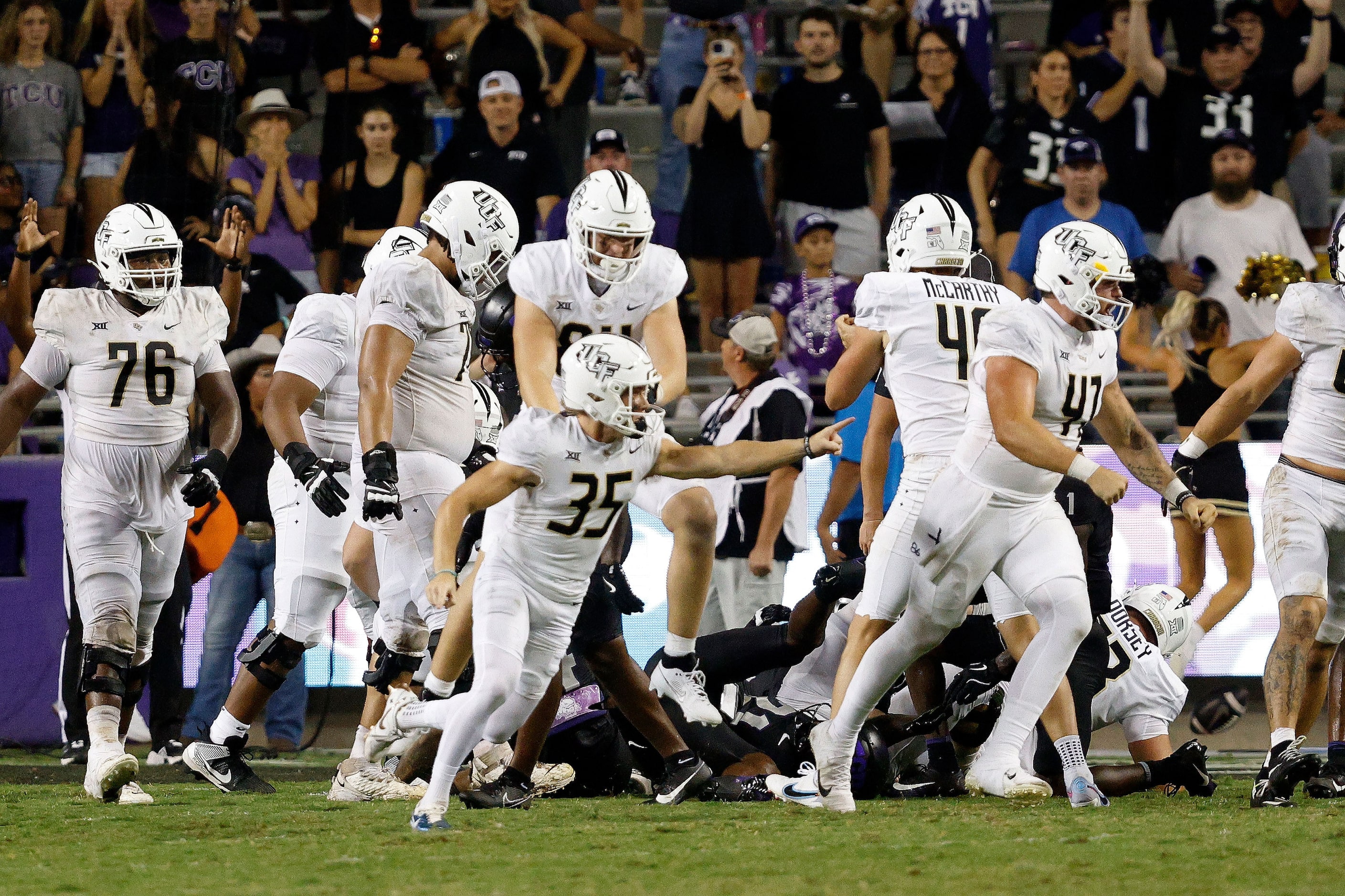 UCF place kicker Colton Boomer (35) celebrates after scoring his game winning field goal...