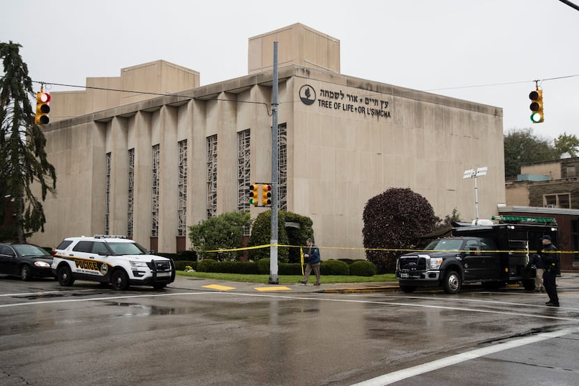 Police stand guard outside the Tree of Life Synagogue in Pittsburgh where a shooter opened...
