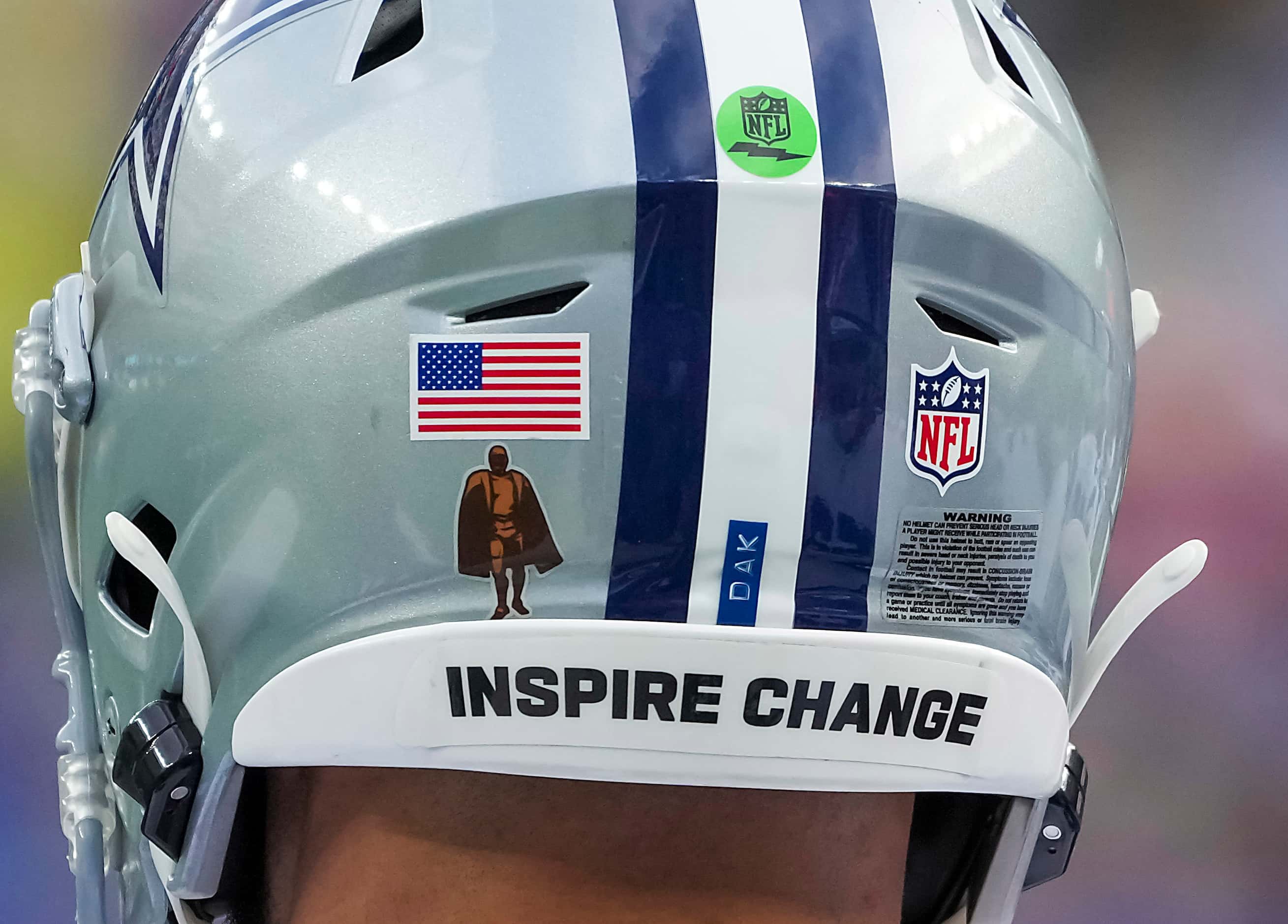 A message on the back of the helmet of Dallas Cowboys quarterback Dak Prescott reads ...