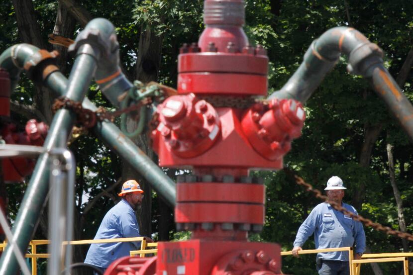  Workers labor at a Range Resources fracking site in Claysville, Pa. (File Photo/The...