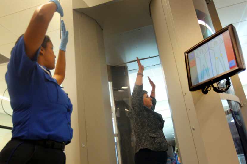 TSA employees demonstrate new body scanning technology at Dallas Love Field. The machines...