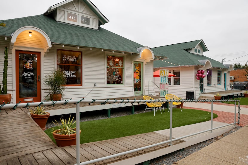 Salter Pottery and DLM Tots (left) are seen in one of two houses remodeled houses along 8th...