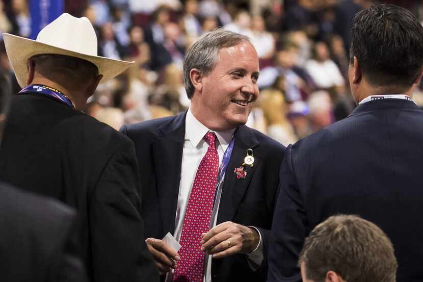 In this 2016 file photo, Ken Paxton chats with the Texas delegation at the Republican...