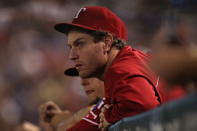 Texas Rangers center fielder Josh Hamilton (32) watches from the dugout in action against...