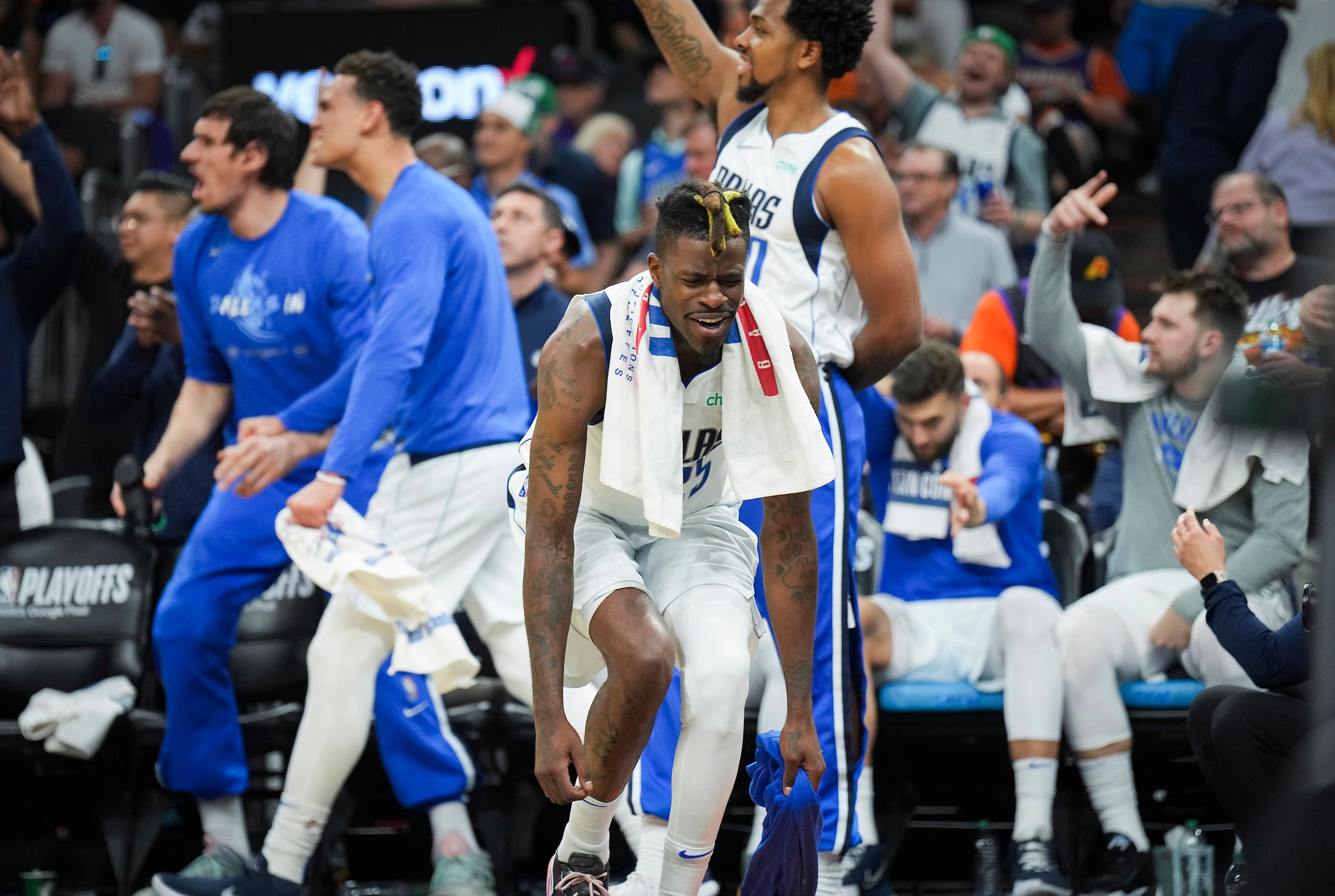 Dallas Mavericks forward Reggie Bullock (25) celebrates on the bench during the fourth...