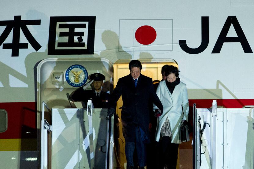 Japanese Prime Minister Shinzo Abe and his wife Akie steps off from their plane upon they...