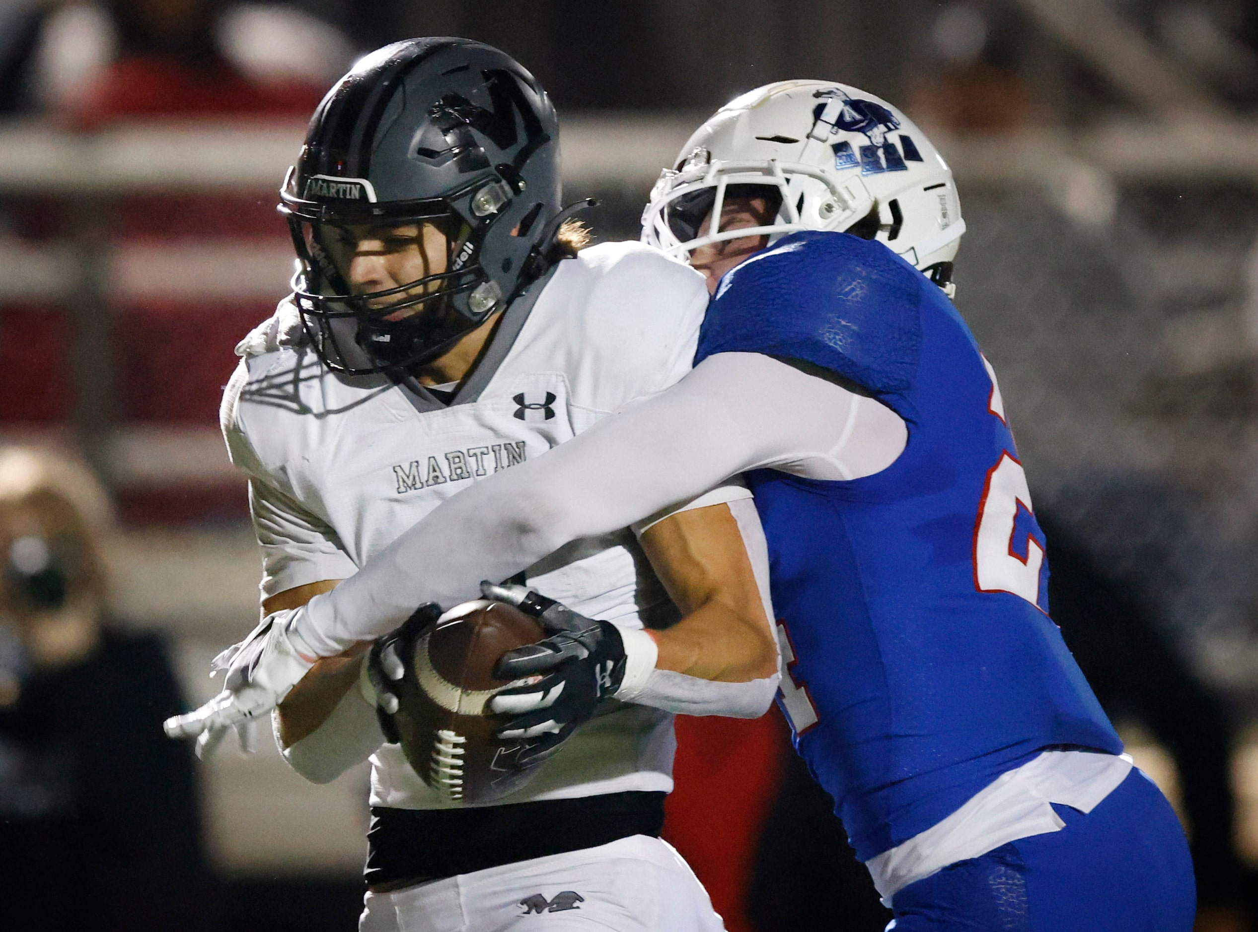 Arlington Martin wide receiver Logan Baresh (4) holds onto a long, second quarter pass as...