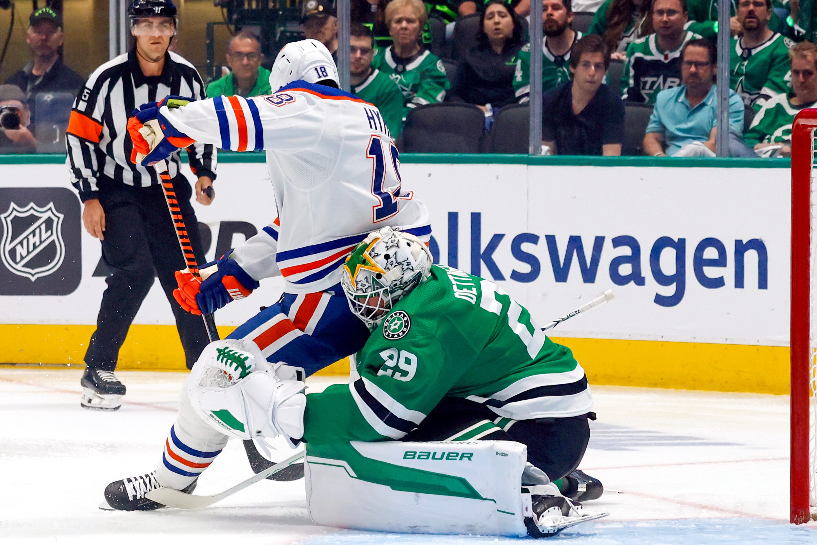 Edmonton Oilers left wing Zach Hyman (18) collides into Dallas Stars goaltender Jake...