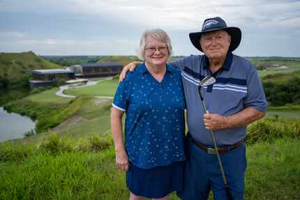 Doug Bolls and his wife, Sherry, pose with his Callaway wedge at Streamsong Blue in Bowling...