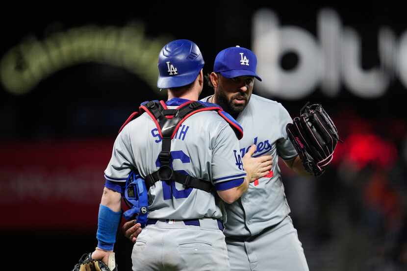 Los Angeles Dodgers catcher Will Smith, left, and pitcher Nabil Crismatt celebrate the...