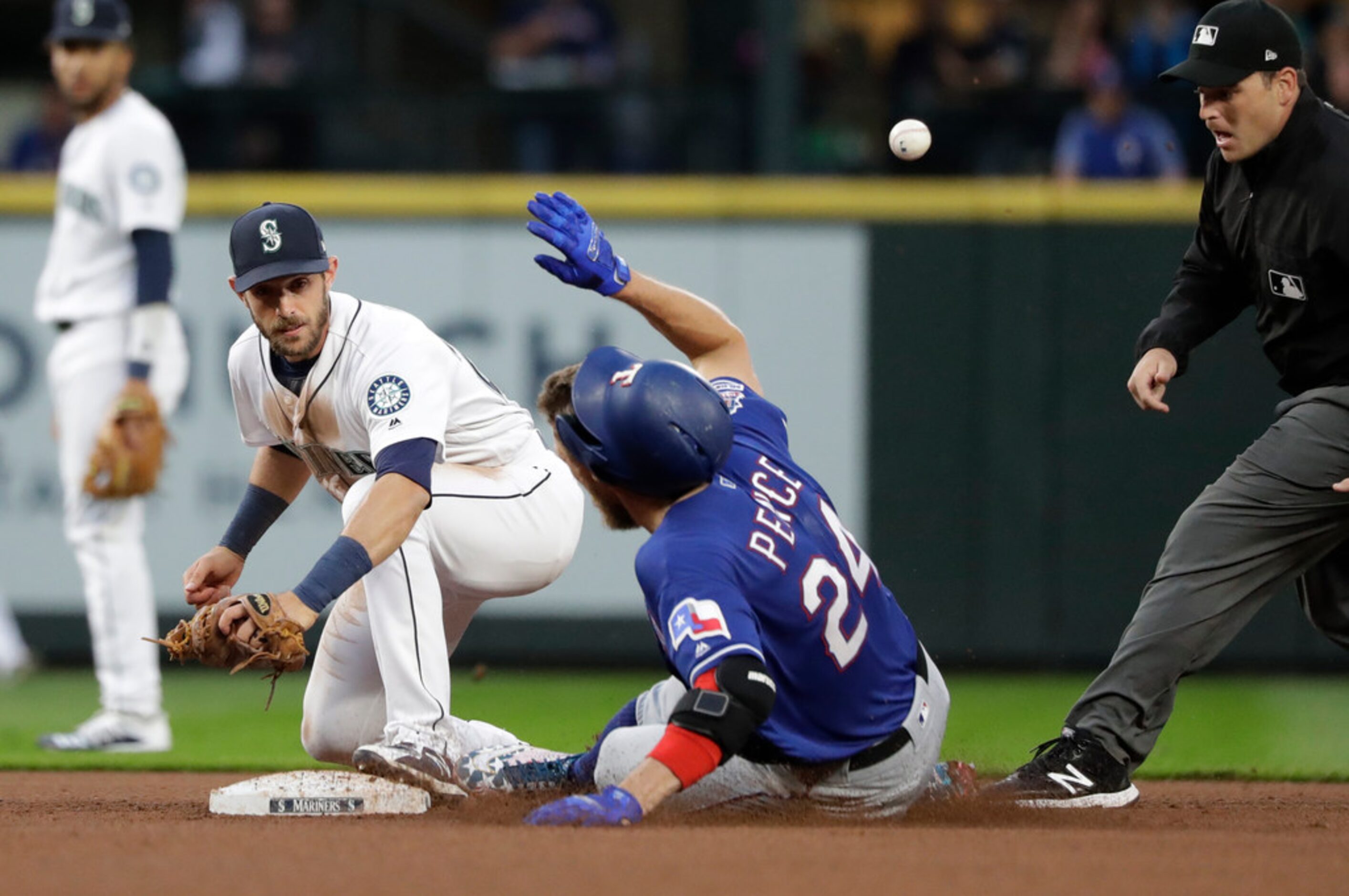 Texas Rangers' Hunter Pence (24) slides safely into second base for a double as the ball...