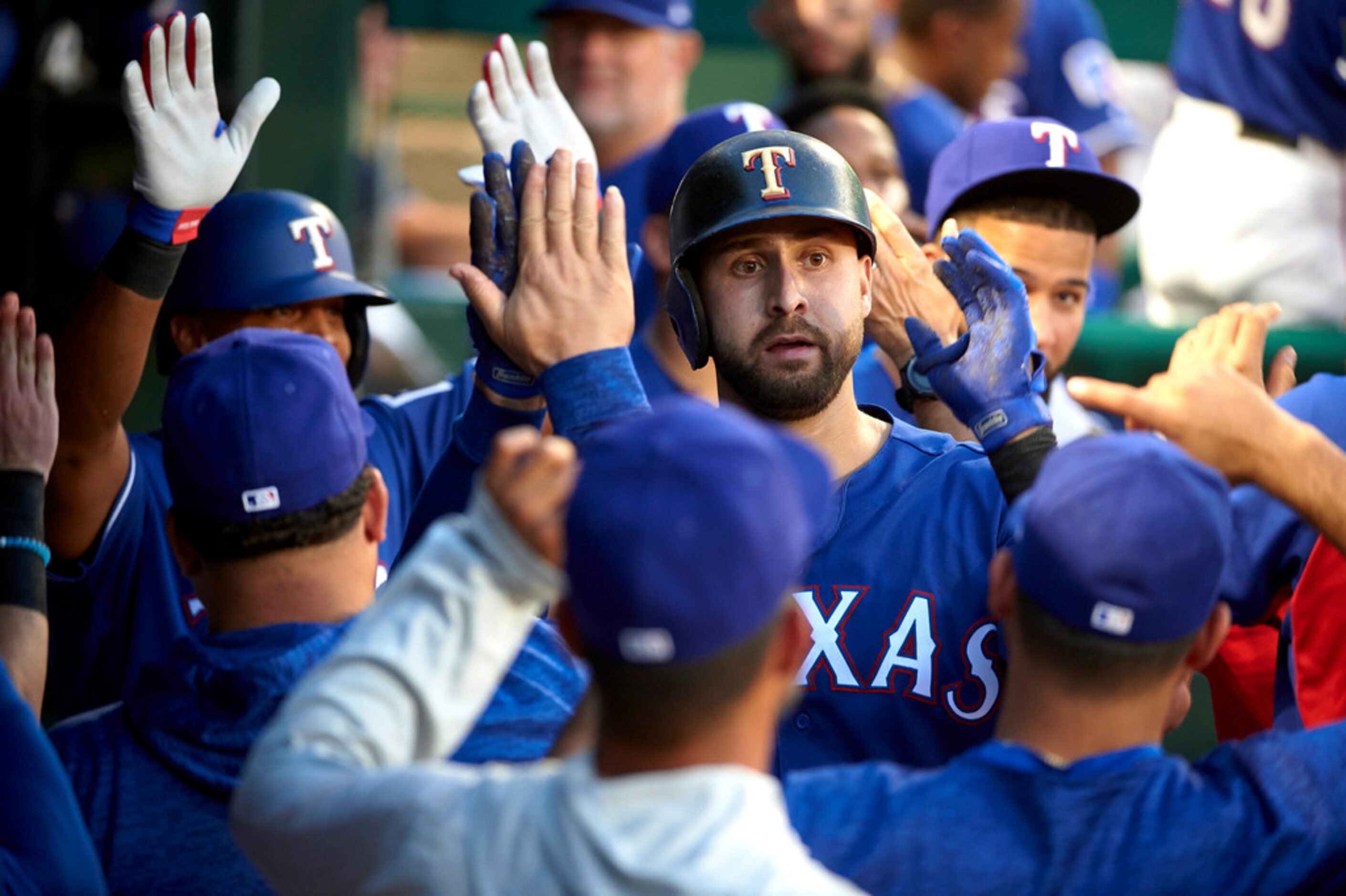 Texas Rangers' Joey Gallo is congratulated after hitting a two-run home run against the...