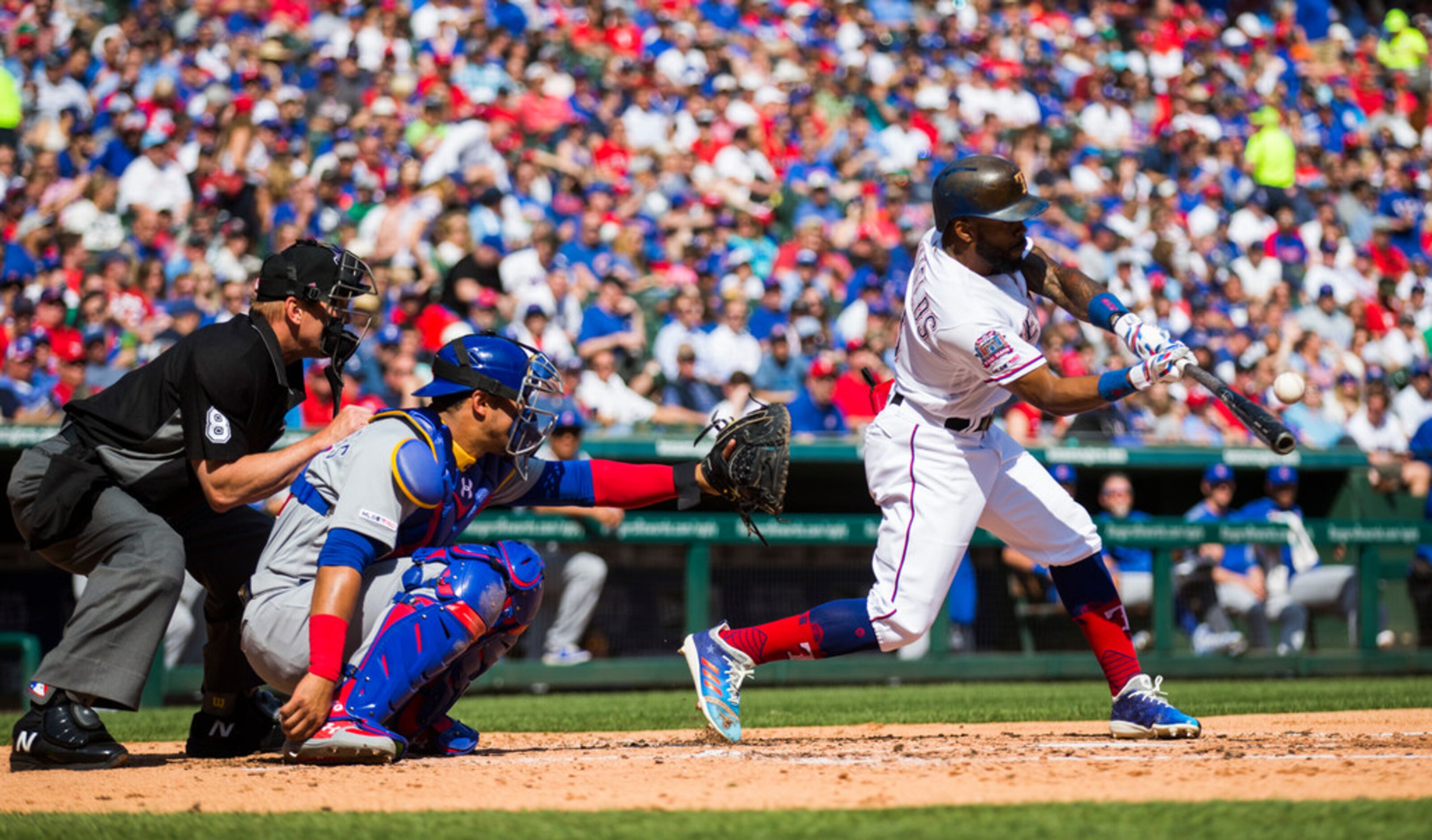 Texas Rangers center fielder Delino DeShields (3) bats during the third inning of an opening...