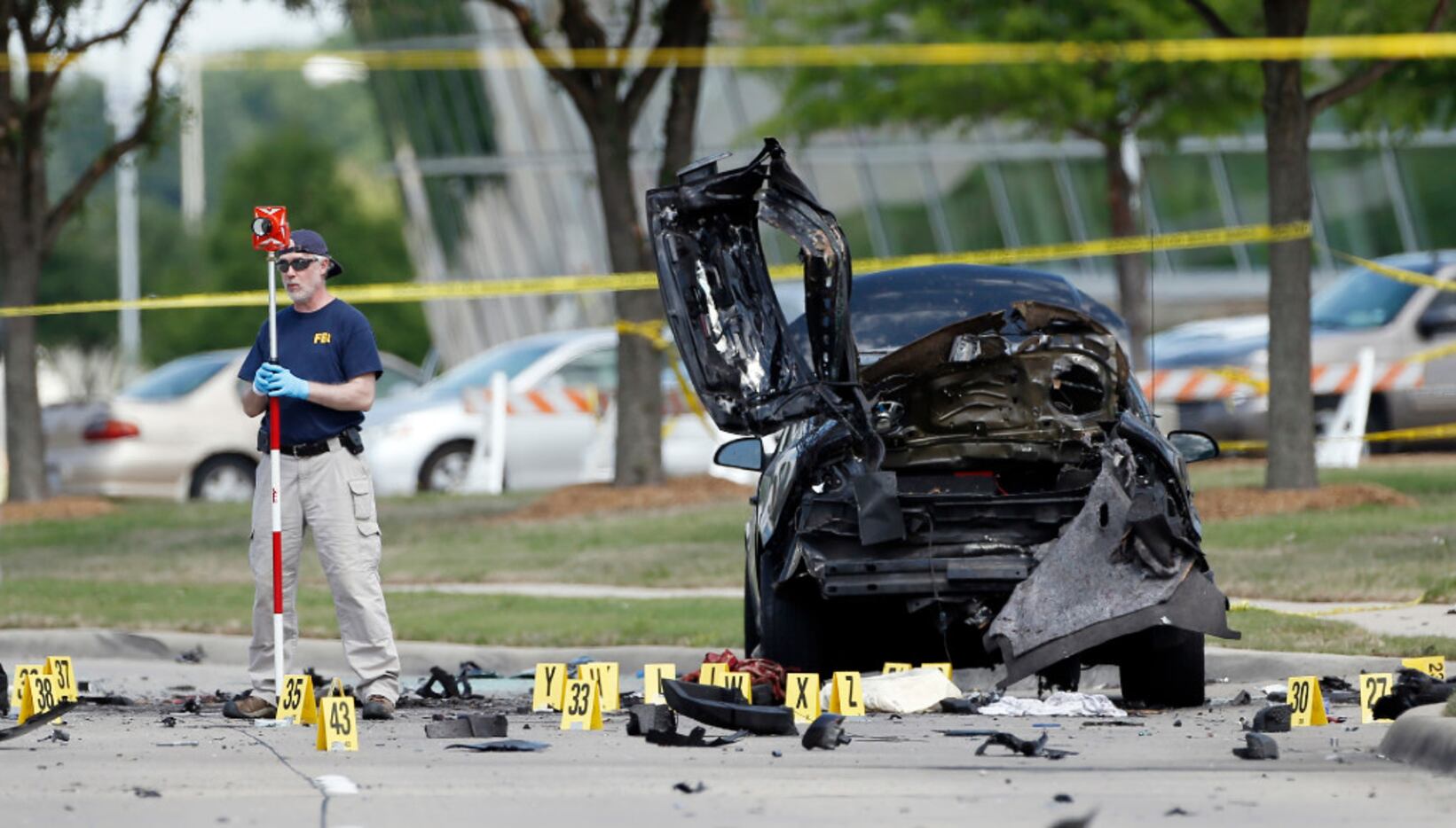 FBI crime scene investigators documented evidence outside the Curtis Culwell Center in...