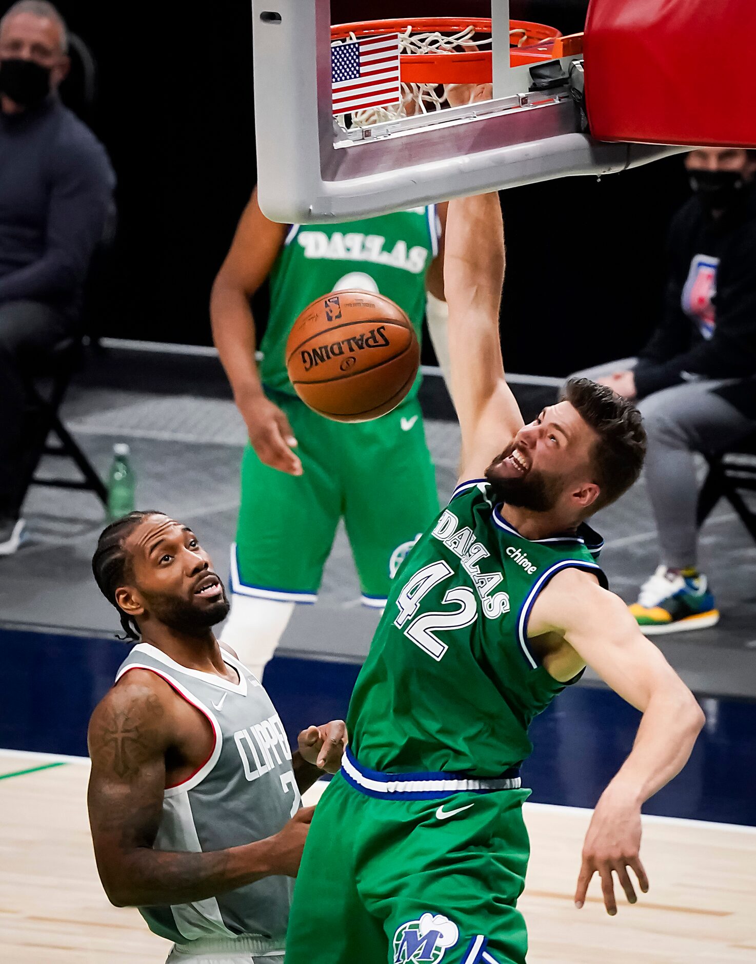 Dallas Mavericks forward Maxi Kleber (42) goes up for a slam dunk over LA Clippers forward...