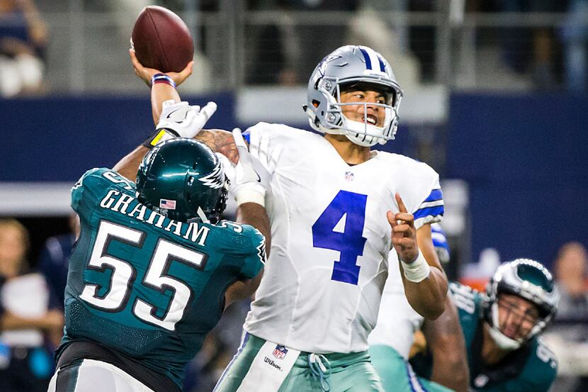 Dallas Cowboys quarterback Dak Prescott (4) is hit by Philadelphia Eagles defensive end...