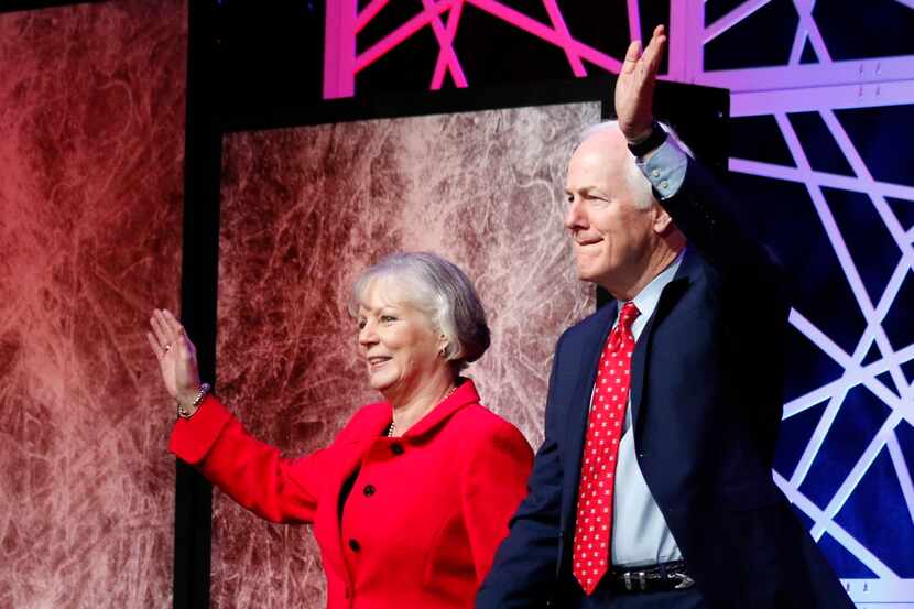  Texas Senator John Cornyn and his wife, Sandy, wave to the crowd during the  Republican...