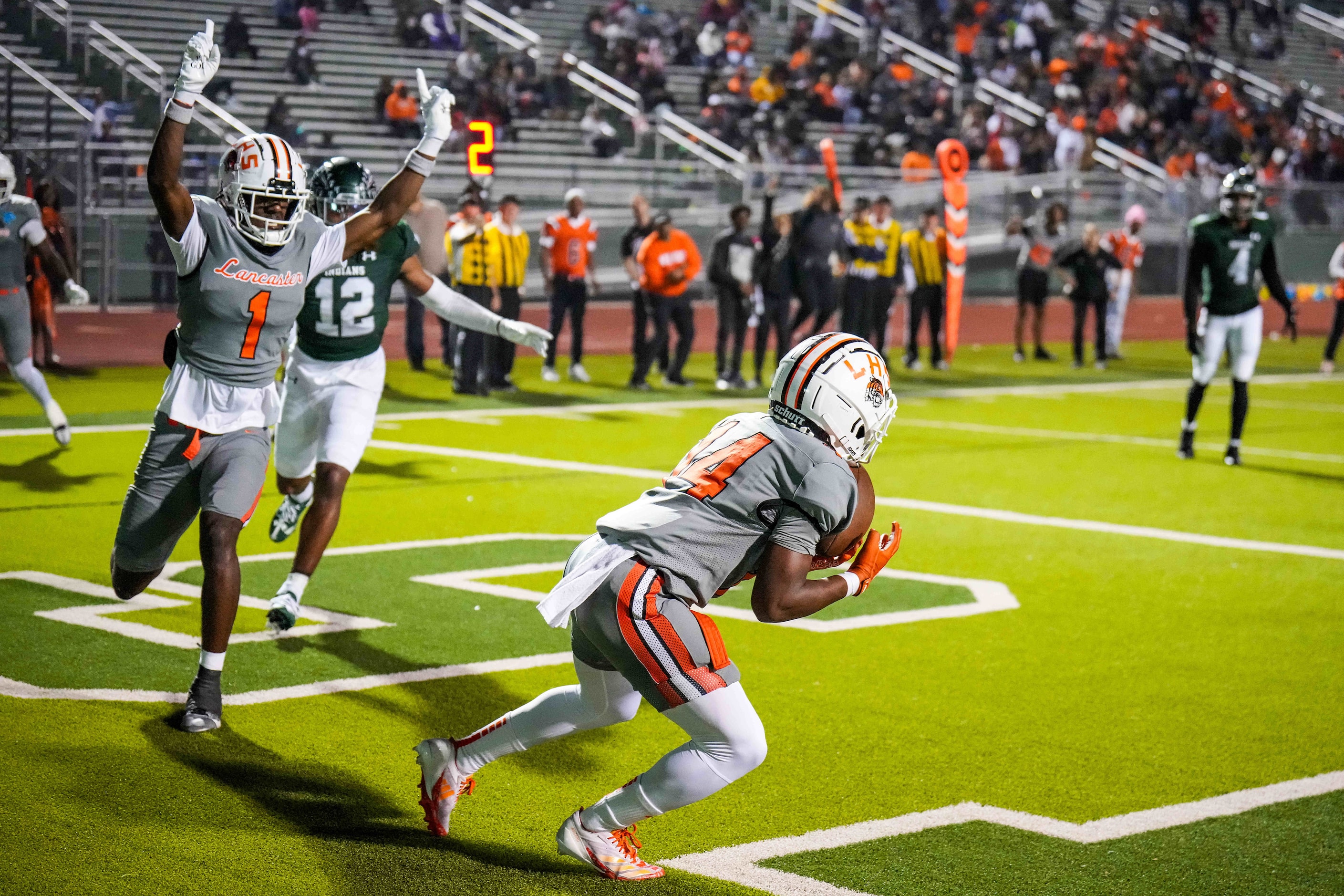 Lancaster’s Emmanuel Choice (1) celebrates as wide receiver Ra'Shon Walker (14) catches a...