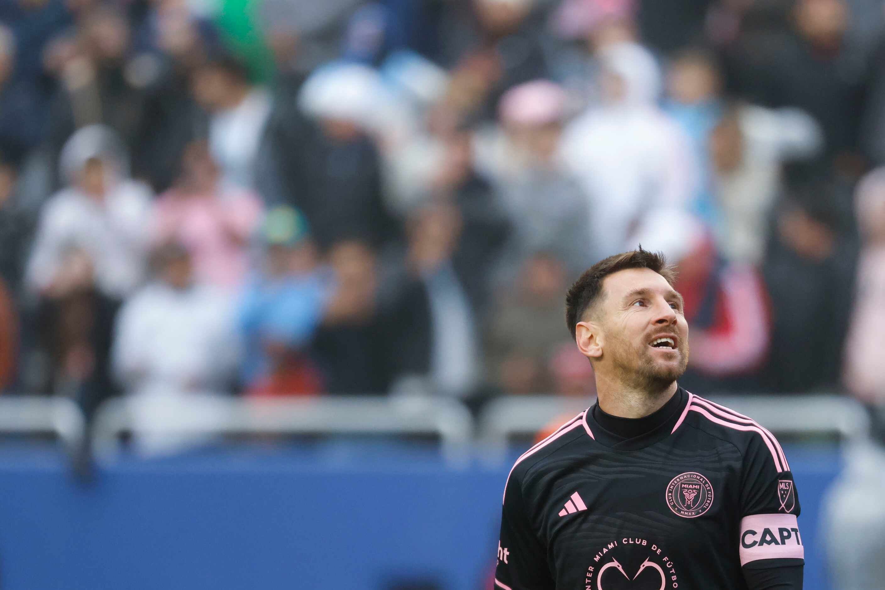 Inter Miami forward Lionel Messi reacts while looking at the big screen after missing to...