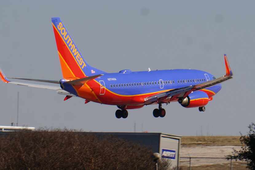  A Boeing 737-700 operated by Southwest Airlines flies into Dallas Love Field.