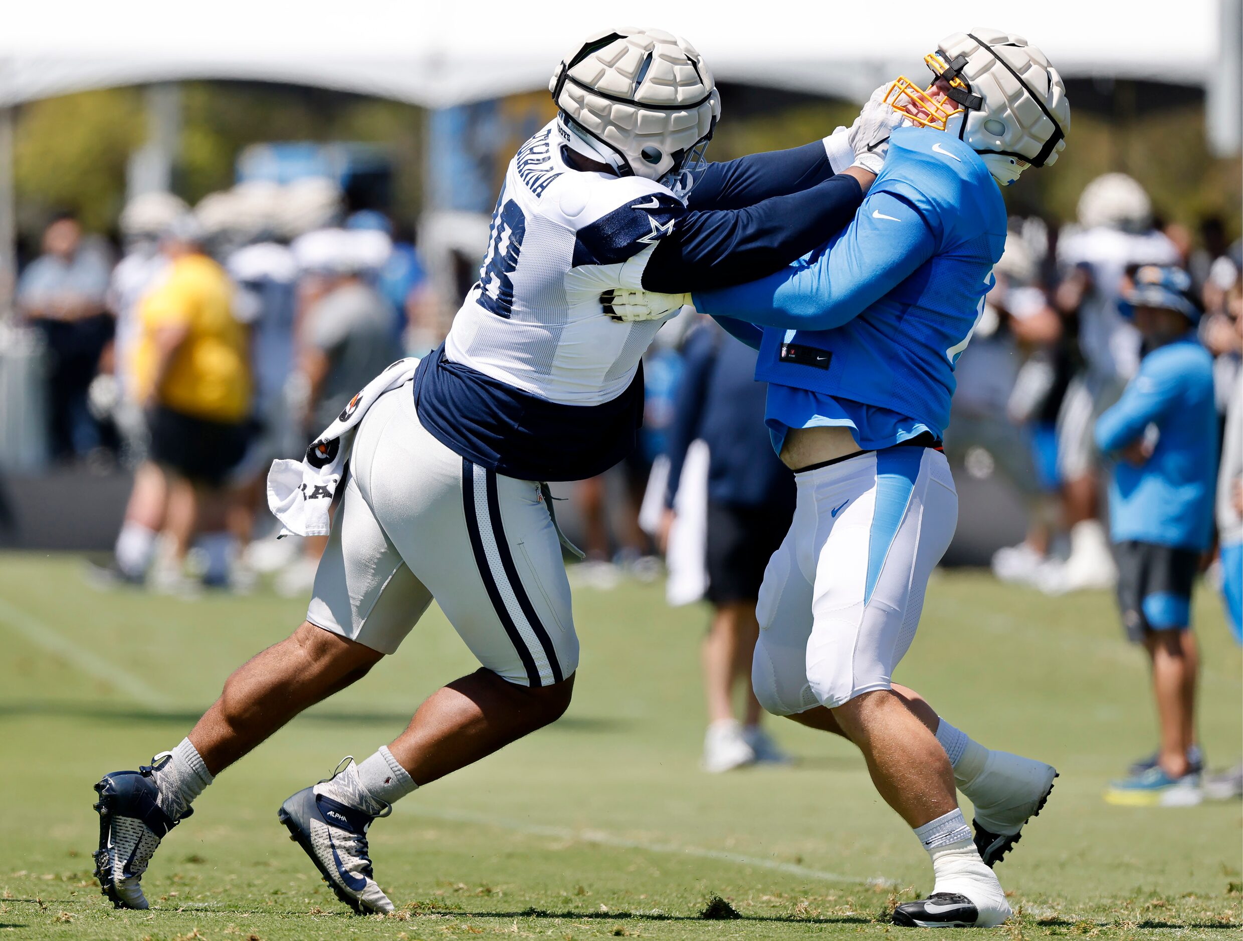 Dallas Cowboys defensive tackle Quinton Bohanna (98) battles Los Angeles Chargers center...