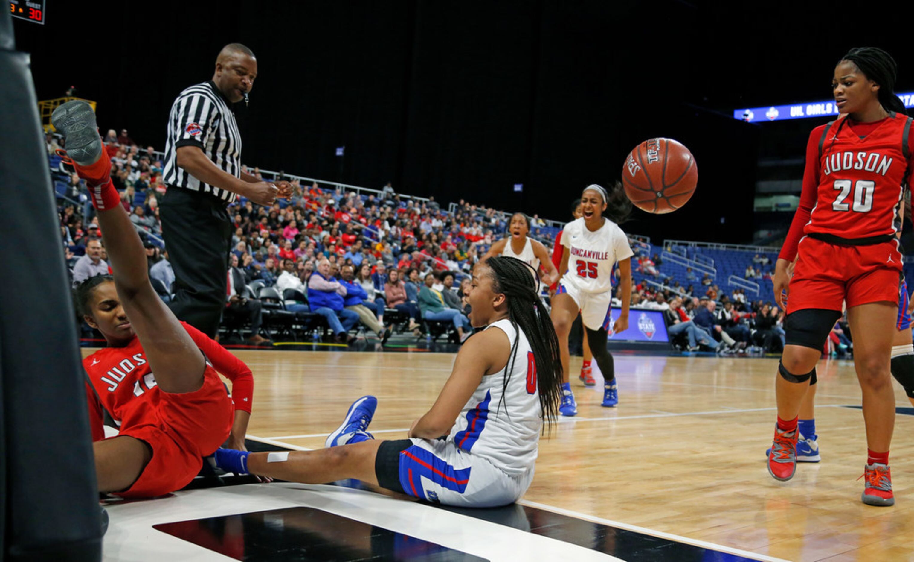 Duncanville guard Hope LeMelle #00 celebrates after making a basket and getting fouled by...