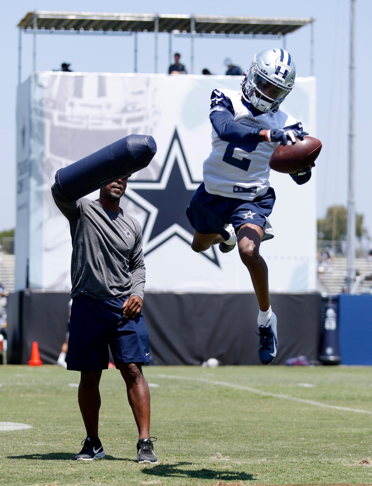 Dallas Cowboys wide receiver KeVontae Turpin (2)  skies over wide receivers coach Robert...