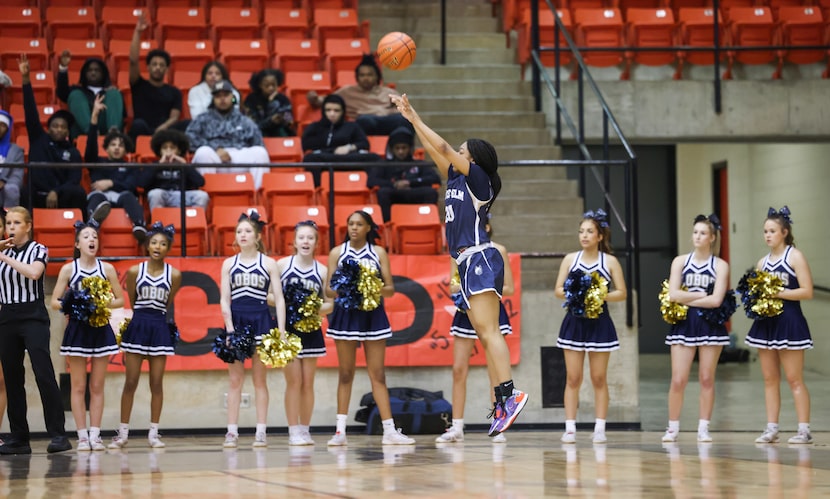 Little Elm sophomore point guard Shiloh Kimpson (20) jumps to take a three-point shot in the...