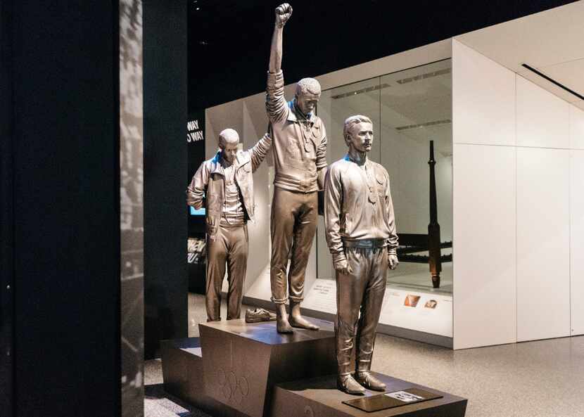 From left: a statue of John Carlos, Tommie Smith and Peter Norman at the 1968 Olympics at...