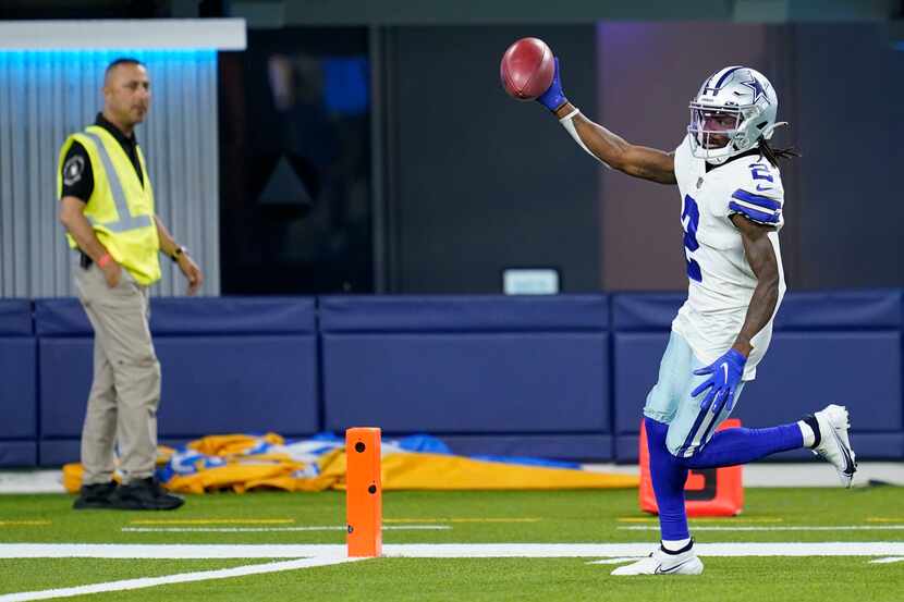 Dallas Cowboys' KaVontae Turpin celebrates as he returns a punt for a touchdown during the...