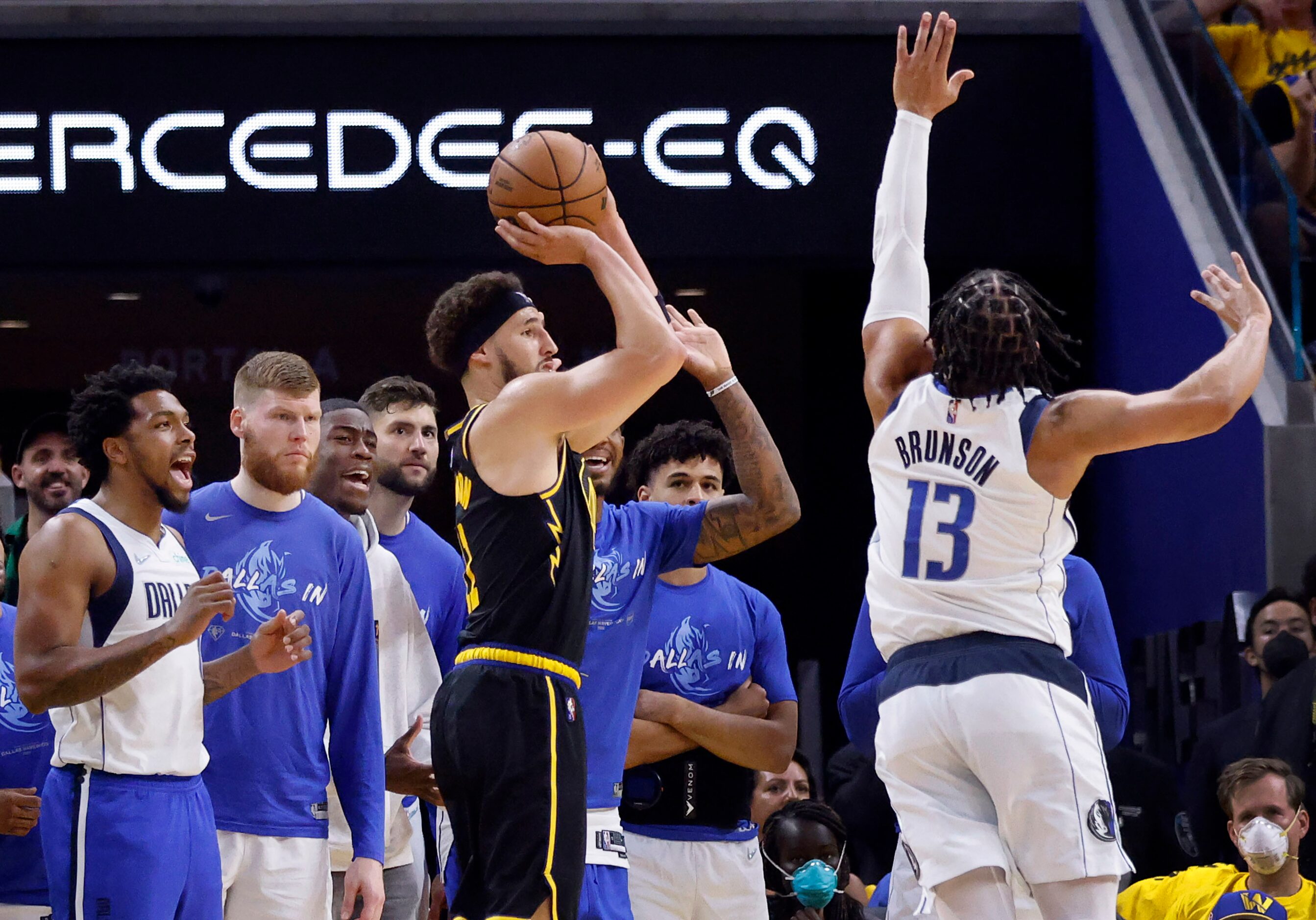 Dallas Mavericks guard Jalen Brunson (13) tries to get a hand up on Golden State Warriors...