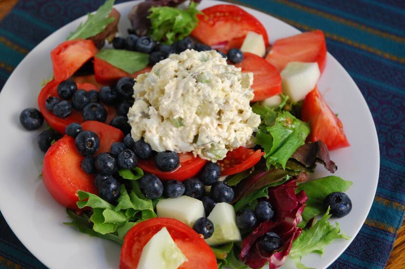 Delicious Southern Style Chicken Salad on a bed of greens, fruits and veggies.
