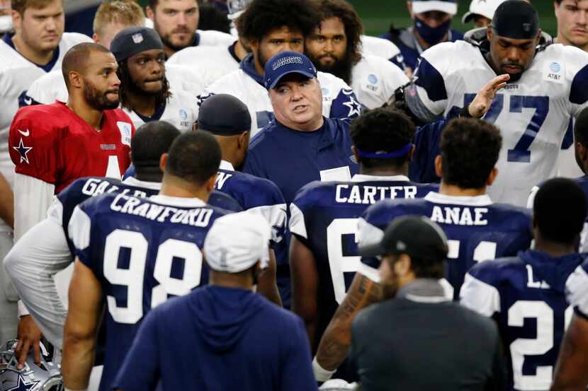 Dallas Cowboys head coach Mike McCarthy talks to the team after practice during training...